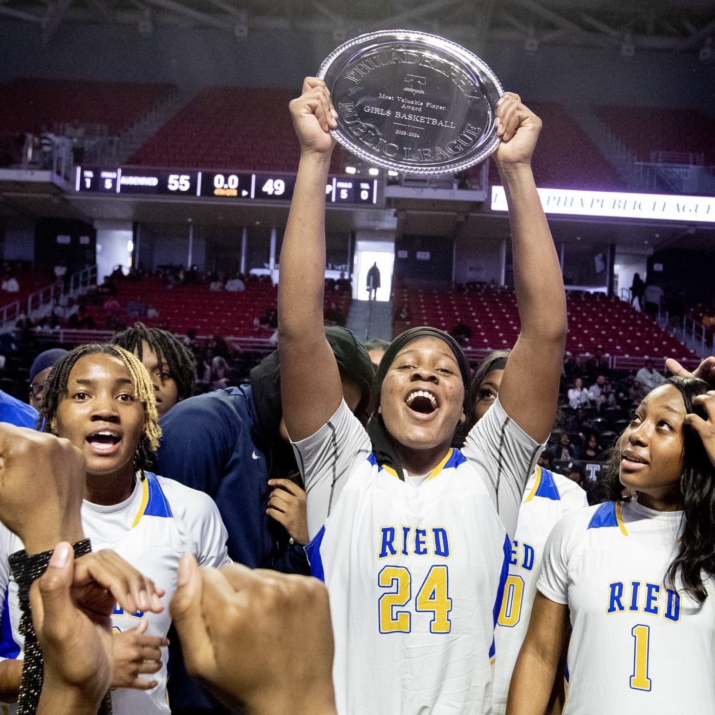 Shayla  Smith of Audenreid hold up the most valuable player award in the Philadelphia Girls Public League Championship at the Liacouras Center on Feb. 24, 2024.